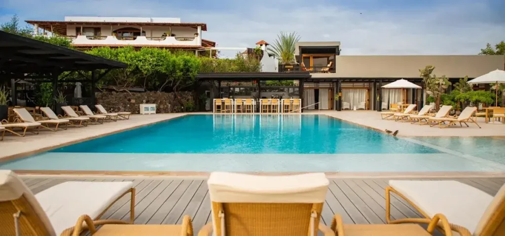 Relax by the beautiful beach side pool at Finch Bay Hotel