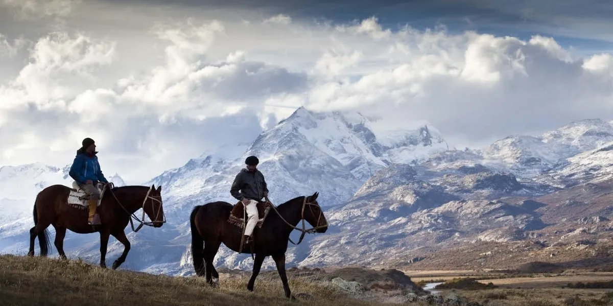 Two people on horse back