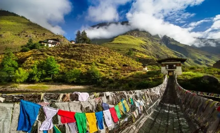 Views and prayer flags as far as the eye can see, on the Druk Path Trek in Bhutan