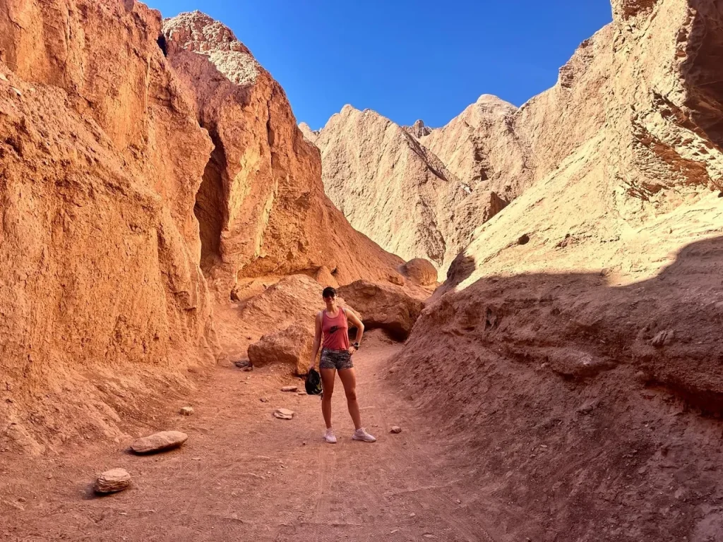 Hiking through red rocks in The Atacama