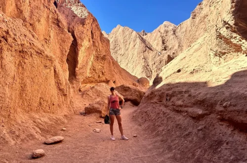 Hiking through red rocks in The Atacama