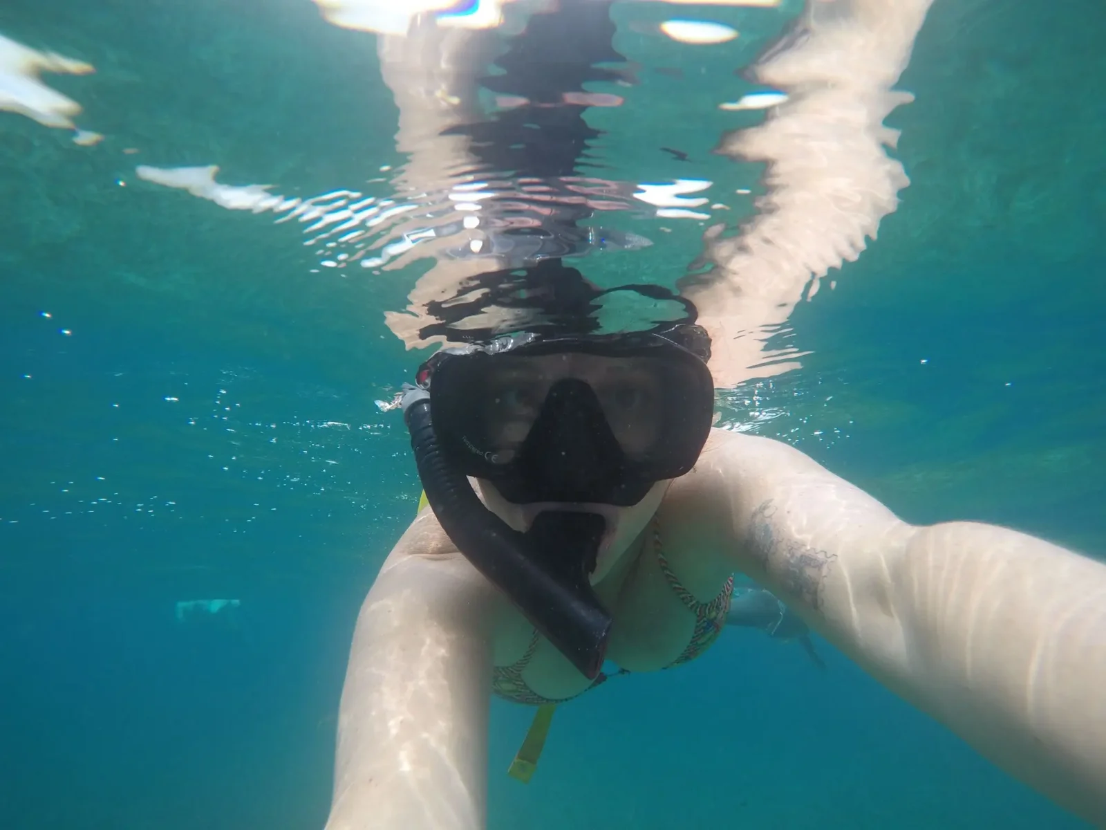 Our guest Jane snorkelling in the clear warm waters of Belize