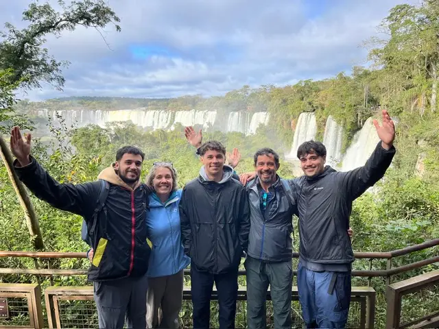 Nicki and family in front of the thundering Iguazu Falls