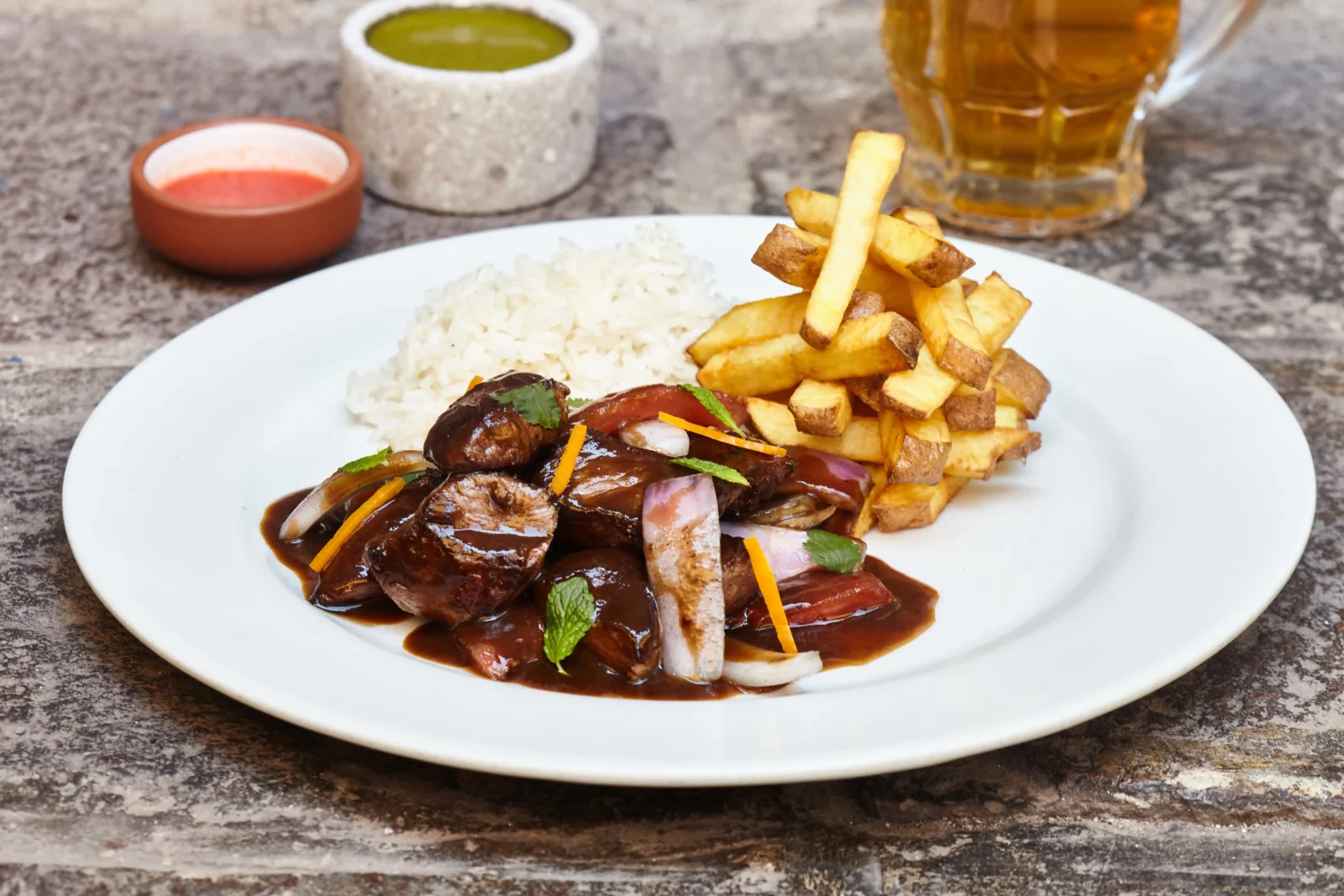 Peru is home to a fusion of cuisines, none more so than Lomo Saltado.