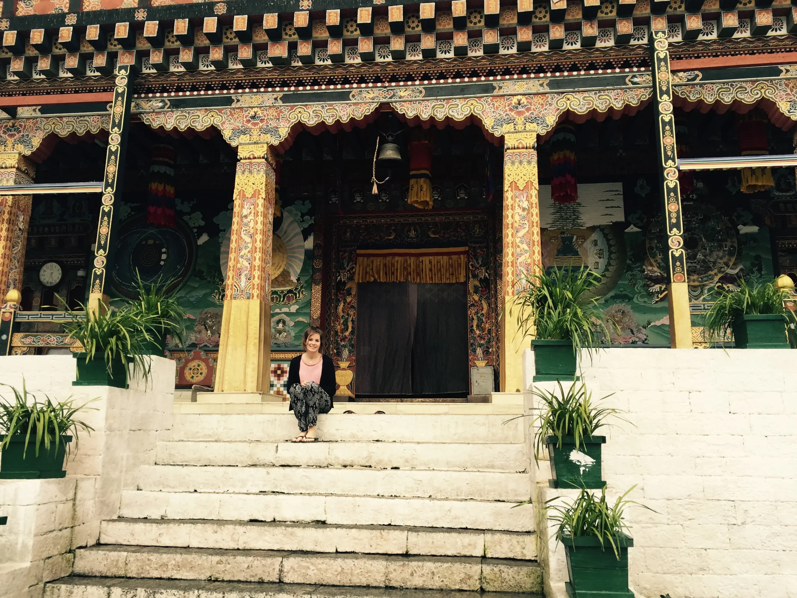 Our Bhutan expert Holly visiting one of the colorful Dzongs in Bhutan