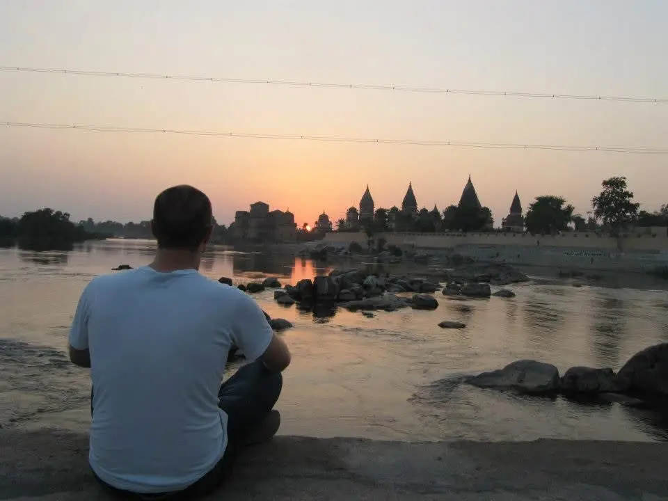 Our founder Sam, sat by one of India's most atmospheric rivers